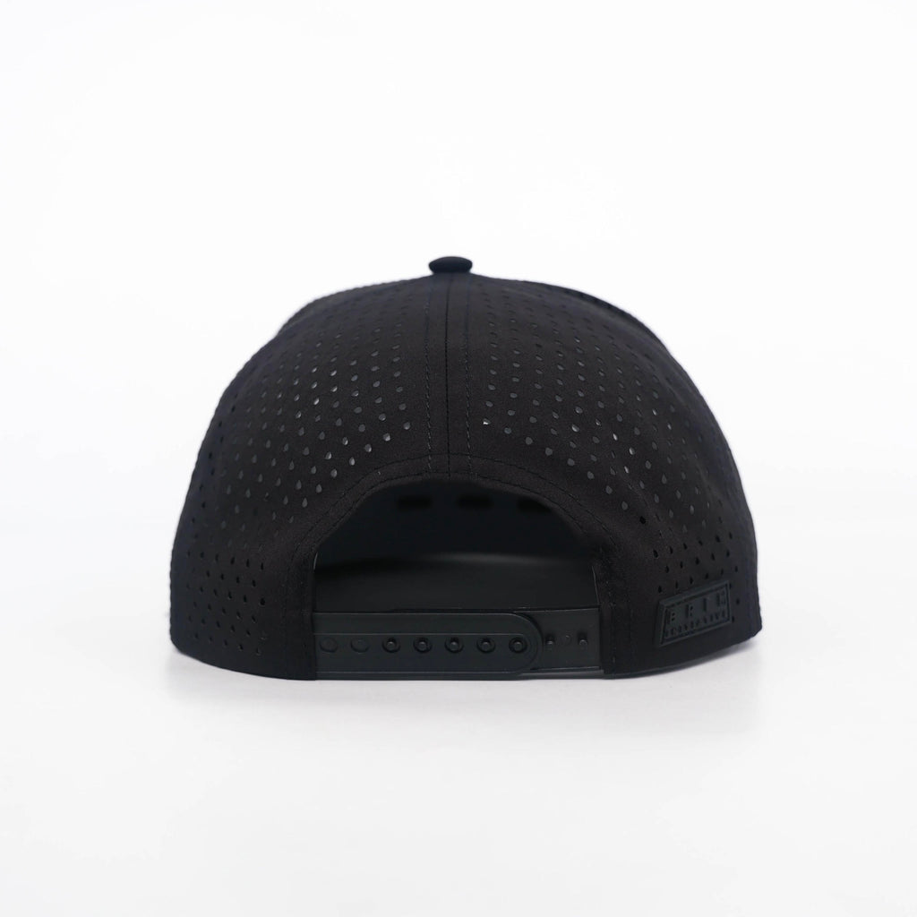 Back view of The Initiative snapback showing laser-perforated ventilation across the crown and the adjustable snapback strap